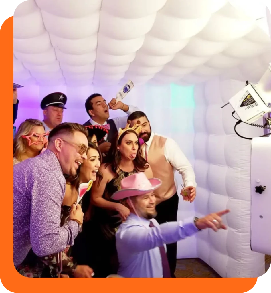 A group of friends in a photo booth rental with Pink Fun Rentals in Winnipeg and Kelowna